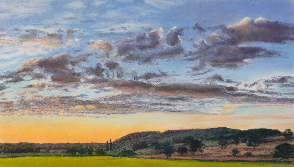 Painting of an evening sky over farmland with hills in background